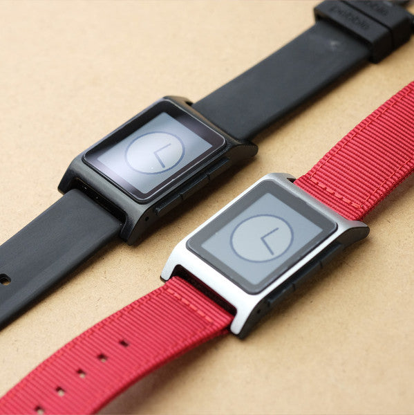 Two Pebble 2 watches on black and red bands